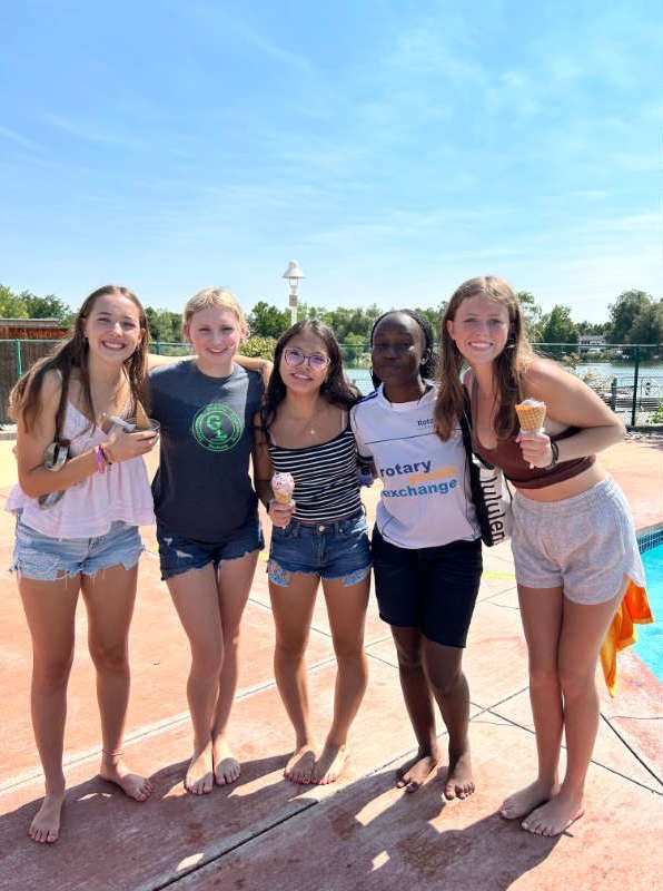 Five Smiling Duck Race Volunteers pose for photo